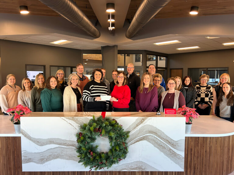 Hays staff present a check to the Heartland Community Foundation as part of 2024 December Giving.