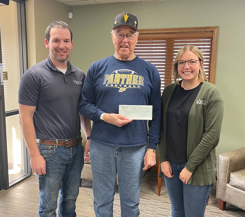 Phillipsburg staff present the Phillips County Ministerial Alliance a donation as part of 2023 December Giving.