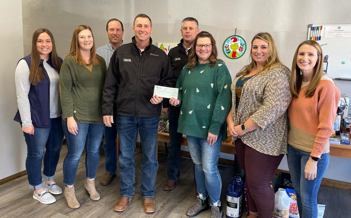 Pratt staff present a check to the Hope Center as part of 2023 December Giving.