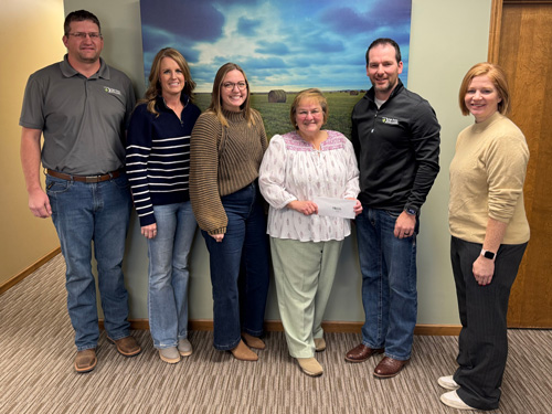 Phillipsburg staff present a check to the Phillips County Ministerial Alliance Food Pantry as part of 2024 December Giving.