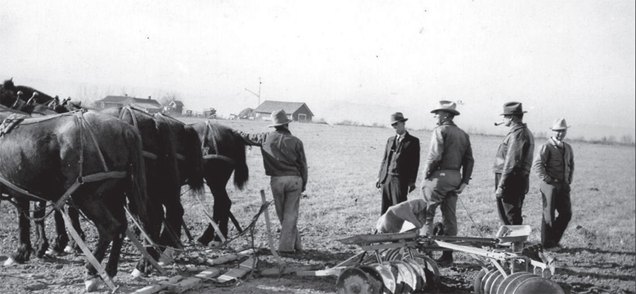 Farmers gather behind a horse-drawn plow during the Great Depression.