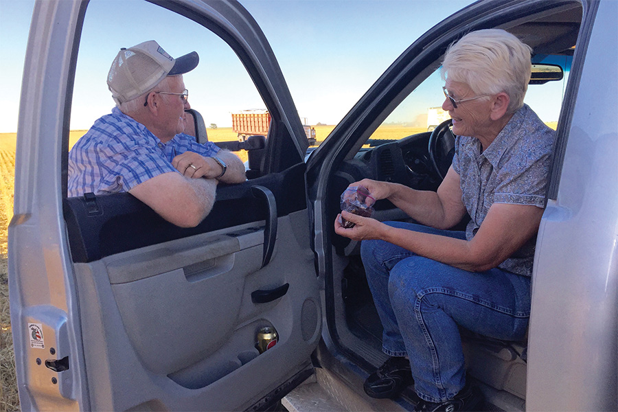 HPFC President and CEO's parents, Dee and Bonnie Swayne share a snack at the farm truck during wheat harvest.