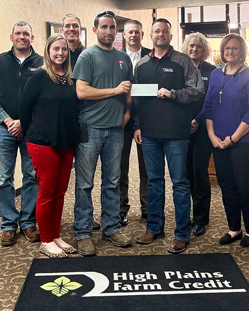 Larned staff present a check to the Rozel Volunteer Fire Department as part of 2025 December Giving.