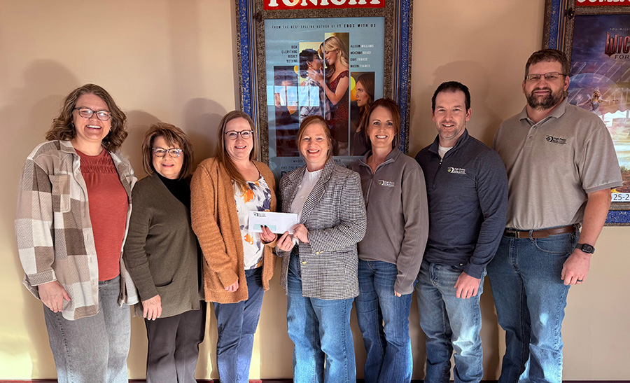 The HPFC team in Phillipsburg gathers at the Majestic Community Theatre to present their donation as part of the 2025 December Giving campaign.